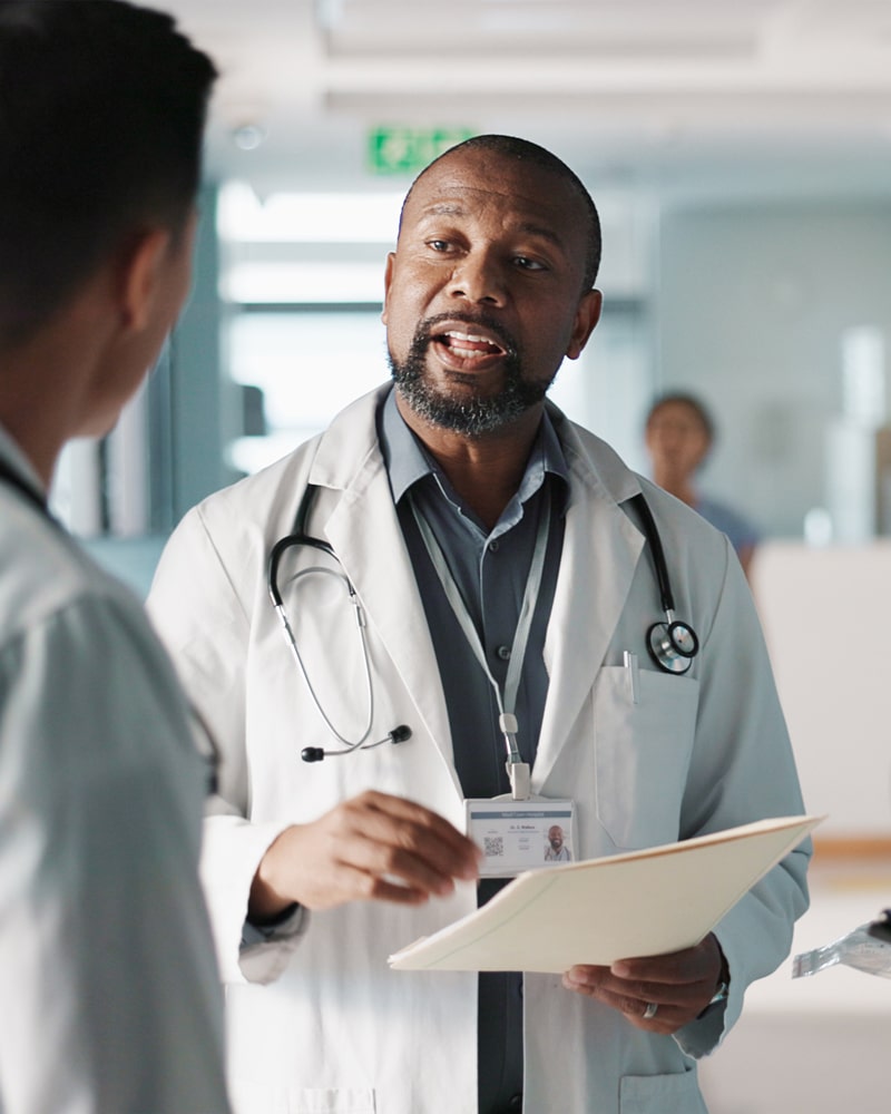 a doctor gives instruction to a staff member