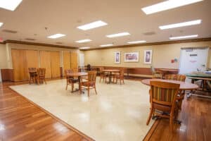 Spacious Prairie Heights dining room with tables and chairs