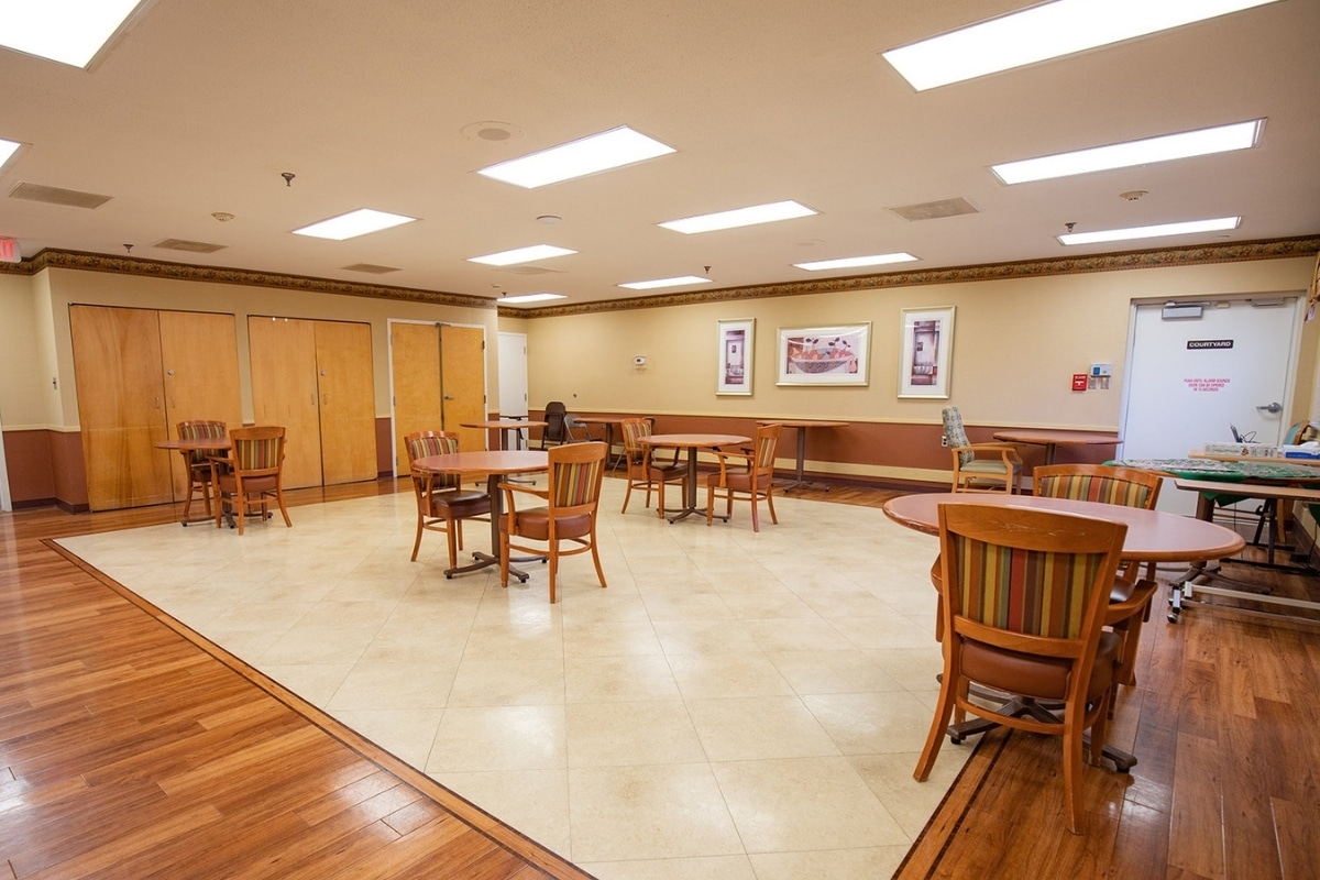Spacious Prairie Heights dining room with tables and chairs