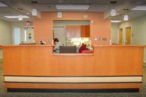 Nurses station with a large reception desk at Prairie Heights
