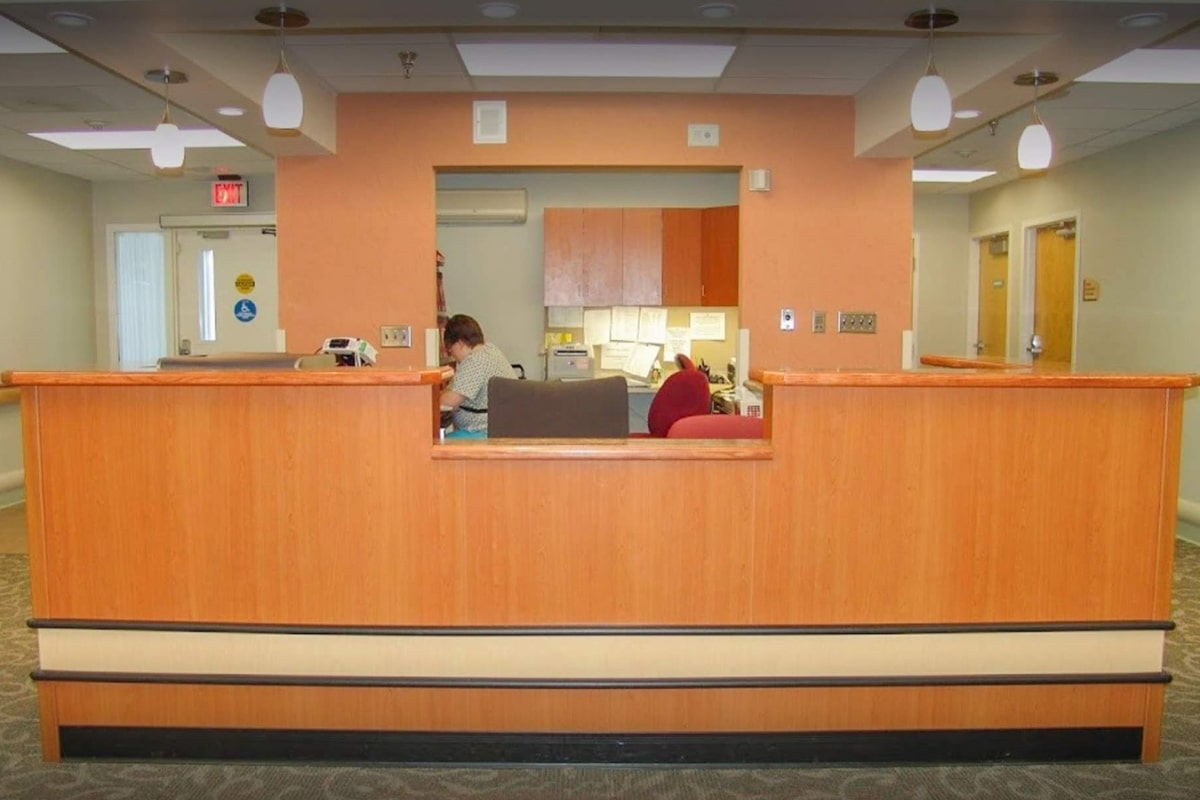 Nurses station with a large reception desk at Prairie Heights