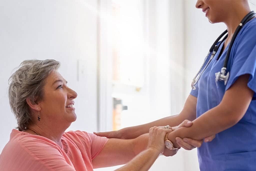 Smiling Prairie Heights team member in a resident care setting